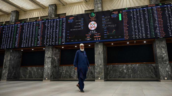 PSX Mixed as Oil Spike Weighs, IMF Talks Limit Losses